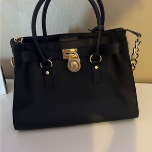 Michael Kors Elegant Black Satchel with Gold Hardware
